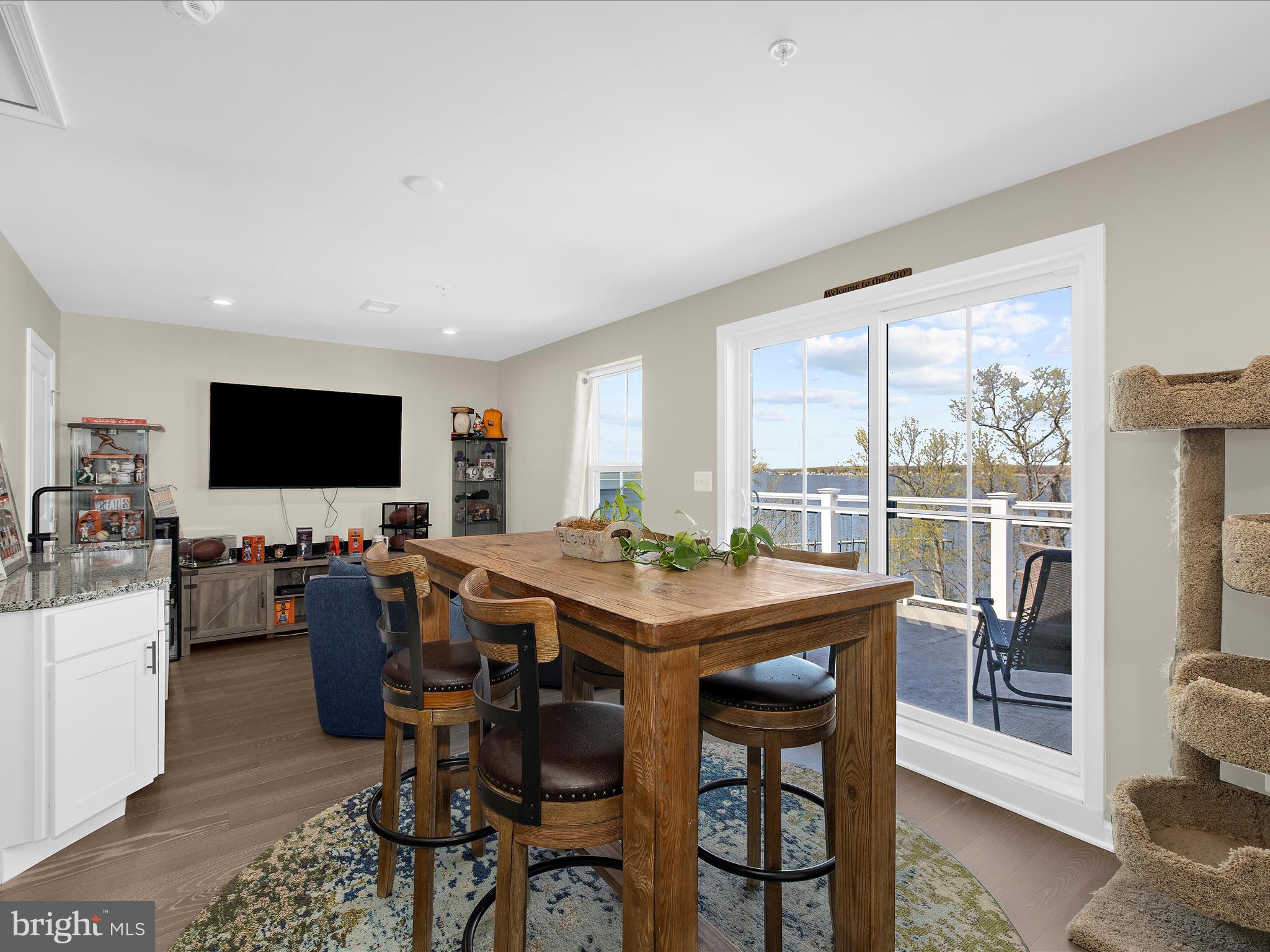 3100 Shaws Road Edgemere, MD 21219 - Photo 47 of 88 a view of a dining room with furniture window and wooden floor