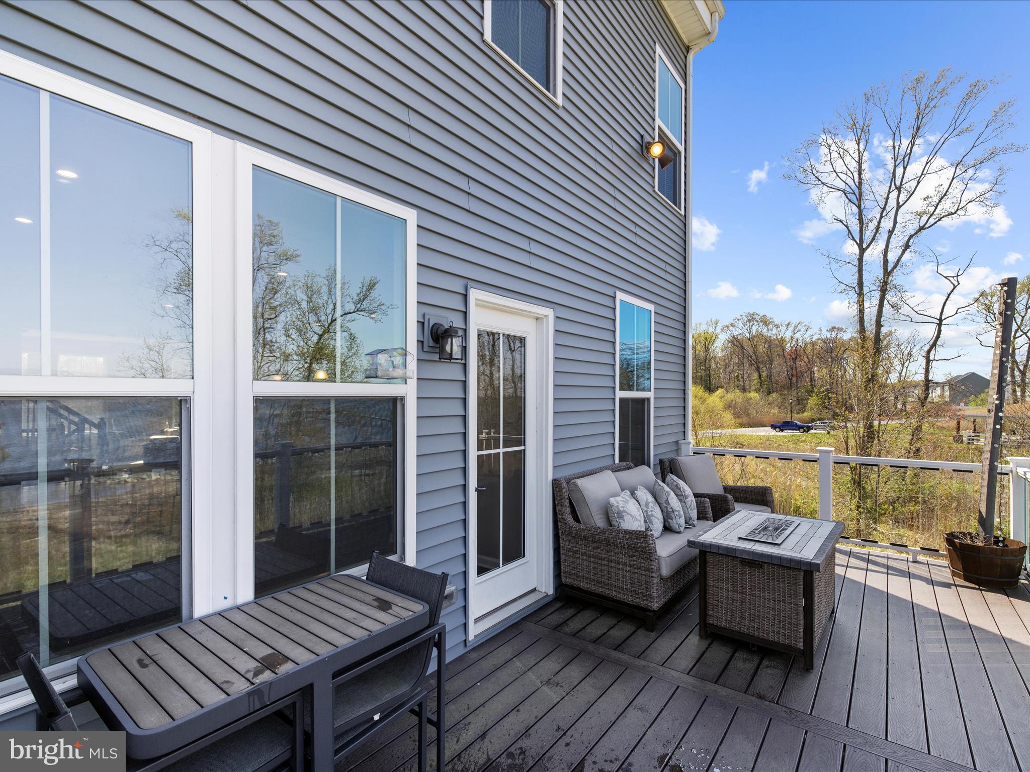 3100 Shaws Road Edgemere, MD 21219 - Photo 50 of 88 a view of balcony with couch and wooden floor