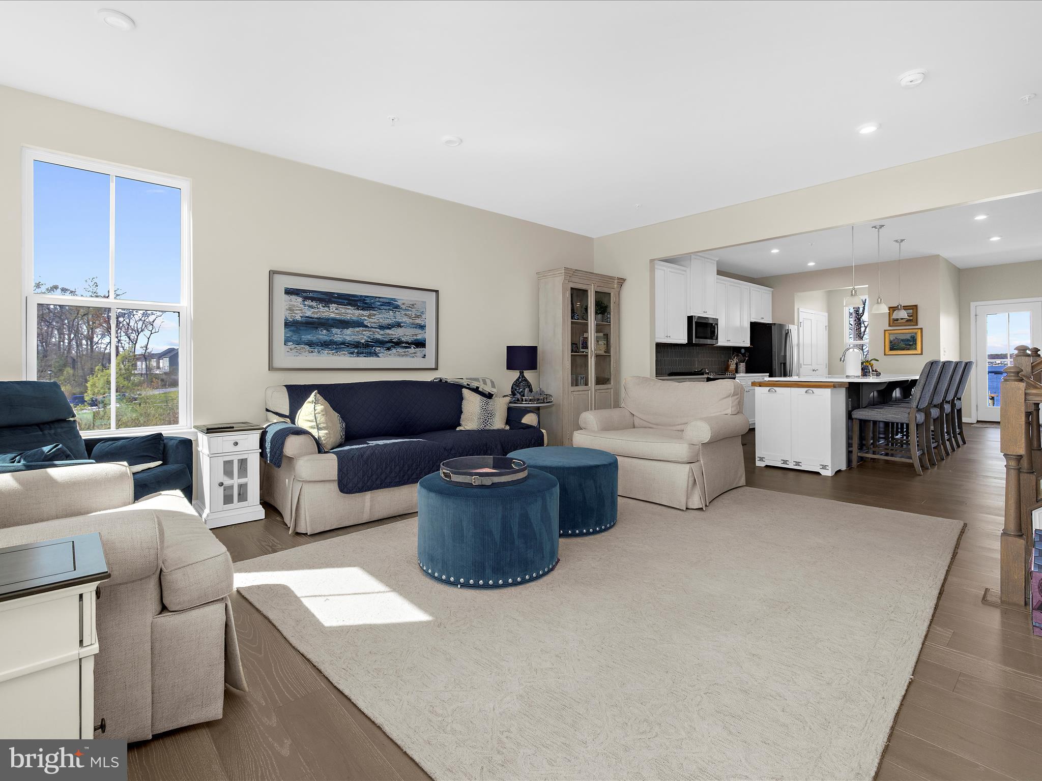 3100 Shaws Road Edgemere, MD 21219 - Photo 5 of 88 a living room with furniture and a dining area with kitchen view