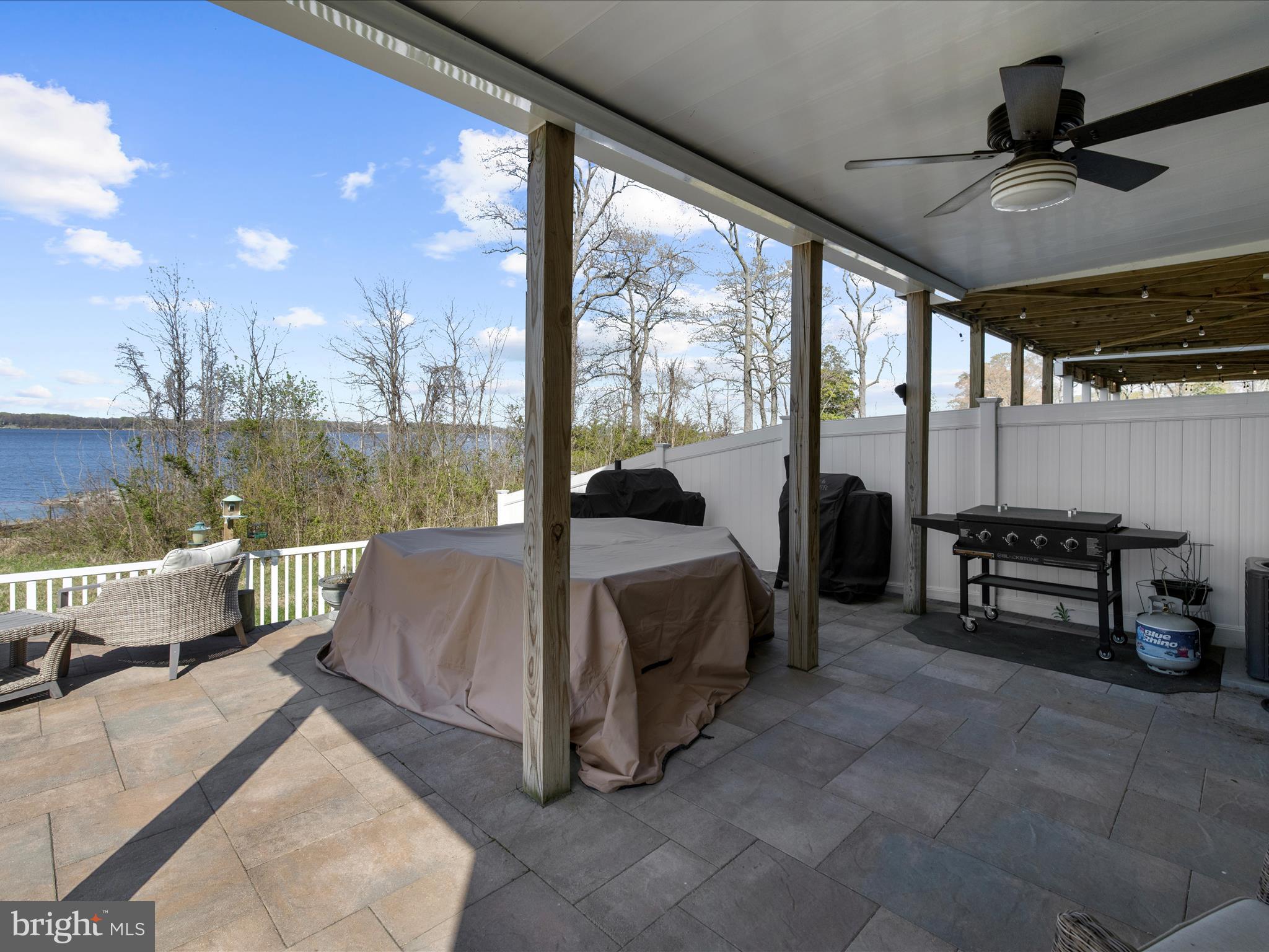 3100 Shaws Road Edgemere, MD 21219 - Photo 58 of 88 a spacious bedroom with a bed a couch and large window