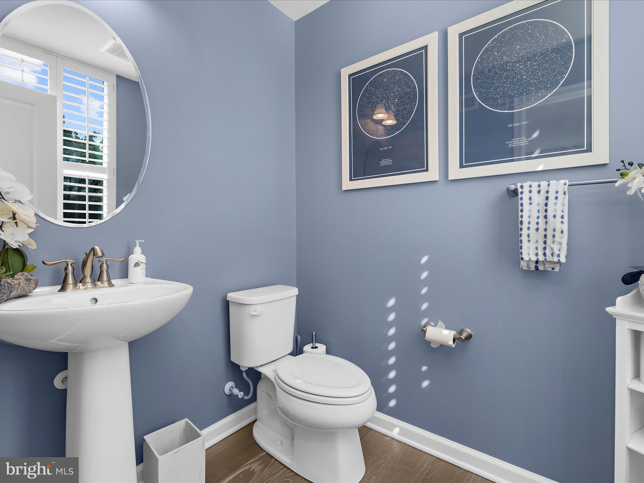 3100 Shaws Road Edgemere, MD 21219 - Photo 6 of 88 a bathroom with a toilet a sink and mirror