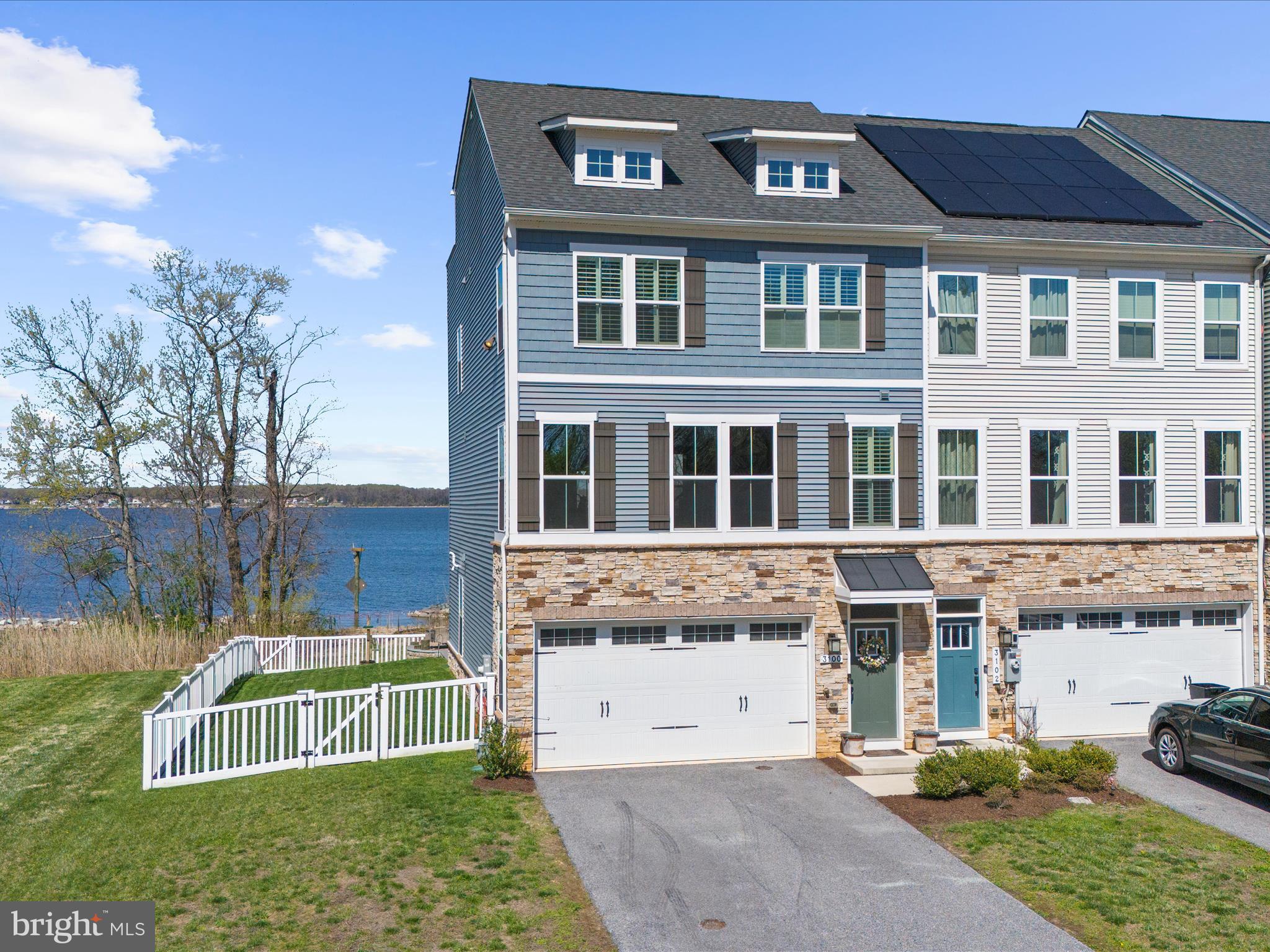3100 Shaws Road Edgemere, MD 21219 - Photo 84 of 88 a view of a white house with a big yard and large trees