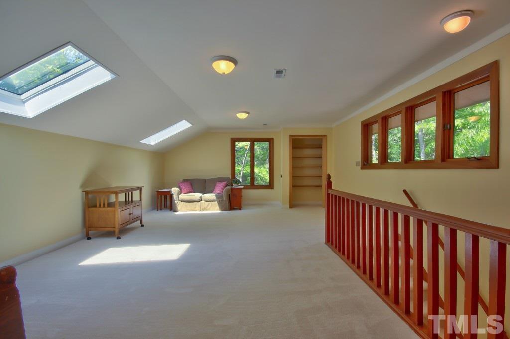 10008 Old Warden Road Raleigh, NC 27615 - Photo 18 of 24 a view of a livingroom with furniture and windows