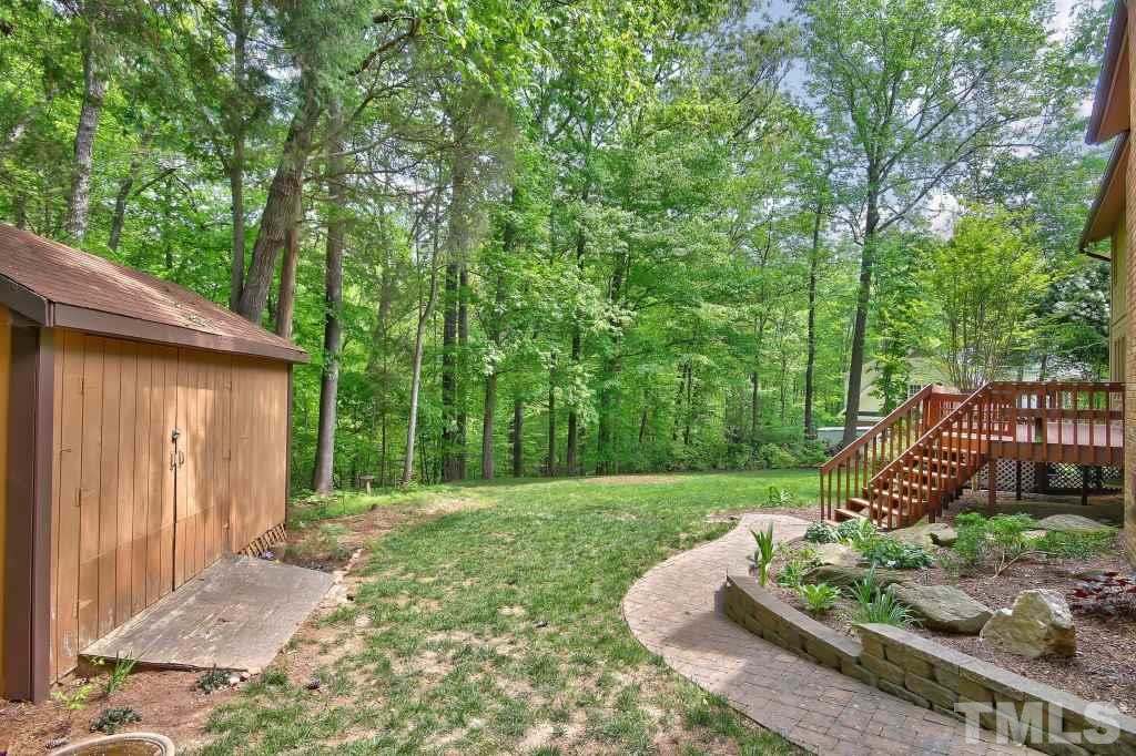 10008 Old Warden Road Raleigh, NC 27615 - Photo 21 of 24 a view of a backyard with wooden fence
