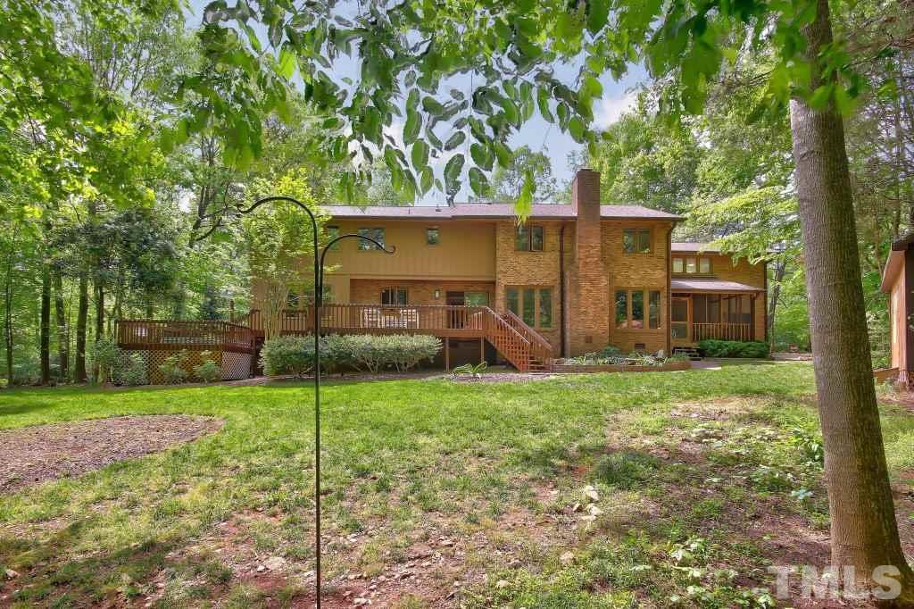 10008 Old Warden Road Raleigh, NC 27615 - Photo 23 of 24 a view of a back yard of the house