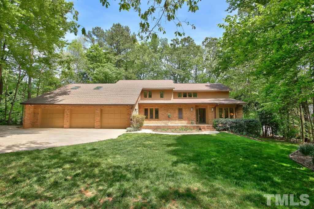 10008 Old Warden Road Raleigh, NC 27615 - Photo 24 of 24 a front view of a house with a garden