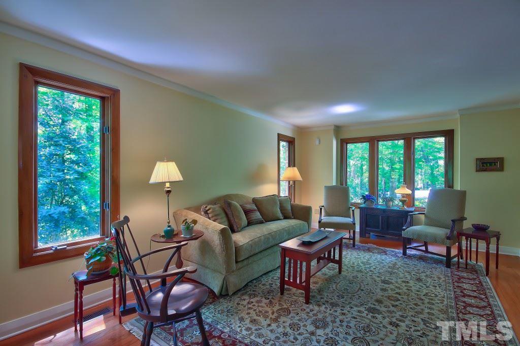10008 Old Warden Road Raleigh, NC 27615 - Photo 5 of 24 a living room with furniture and a large window