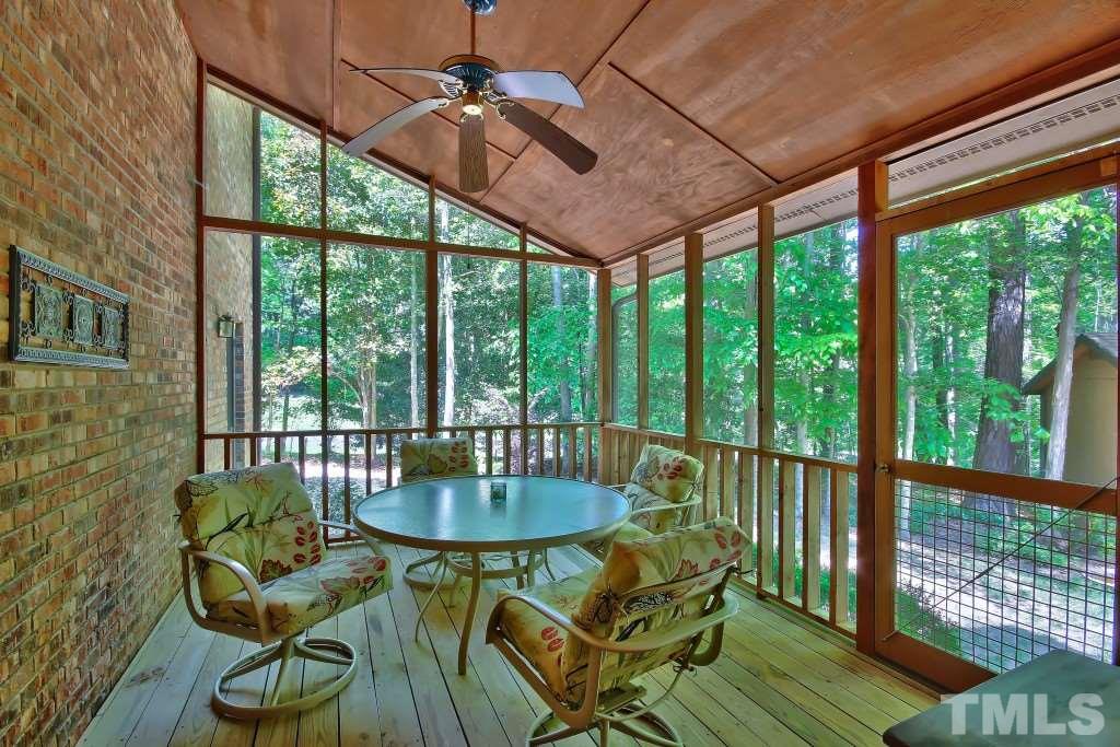 10008 Old Warden Road Raleigh, NC 27615 - Photo 8 of 24 a living room with furniture and a floor to ceiling window