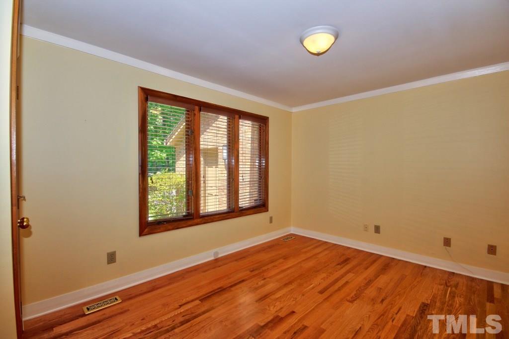 10008 Old Warden Road Raleigh, NC 27615 - Photo 9 of 24 a view of a room with wooden floor and windows