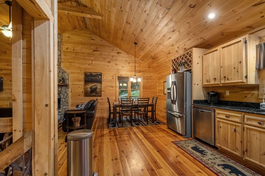 205 Mountain View Road Cherry Log, GA 30522 - Photo 12 of 28 a kitchen with stainless steel appliances a refrigerator and wooden cabinets