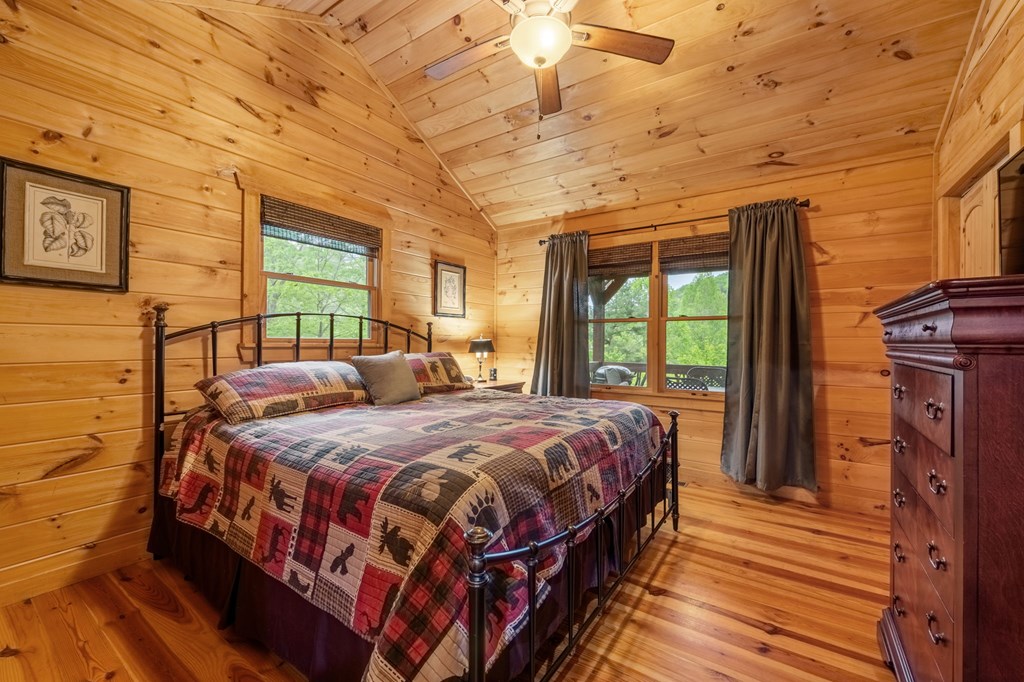 205 Mountain View Road Cherry Log, GA 30522 - Photo 14 of 28 a bedroom with a bed next to a window
