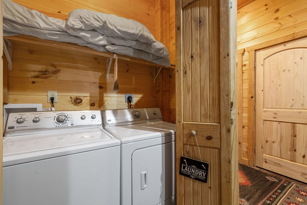 205 Mountain View Road Cherry Log, GA 30522 - Photo 21 of 28 a view of washer and dryer with bathroom in the background