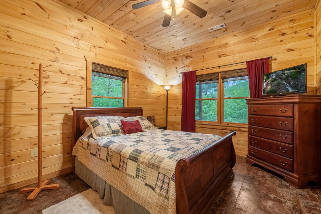 205 Mountain View Road Cherry Log, GA 30522 - Photo 22 of 28 a bedroom with a bed and a dresser