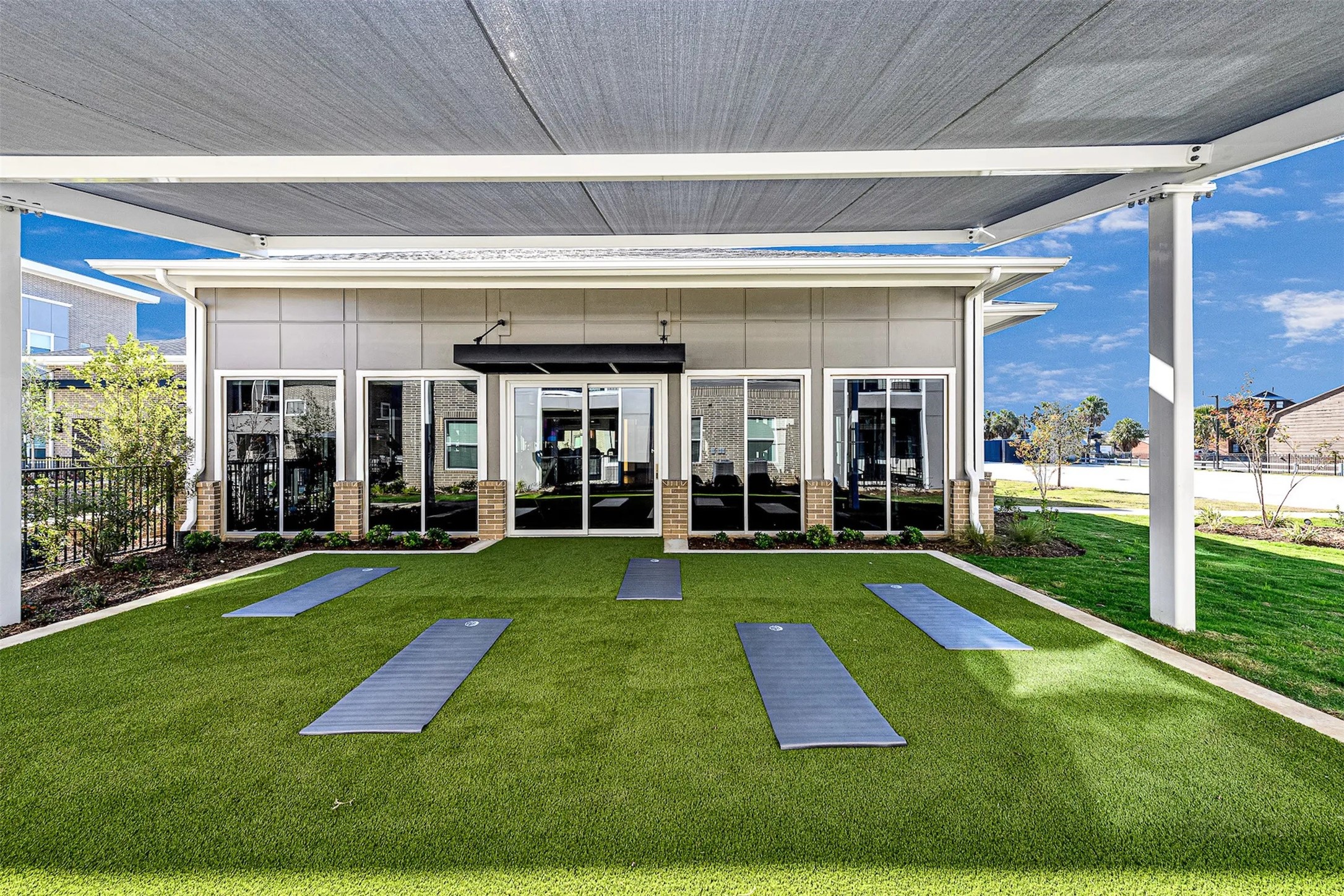 3830 Fm 2920 Rd Spring, Unit 4310 Spring, TX 77388 - Photo 12 of 32 a view of a big yard with floor to ceiling windows