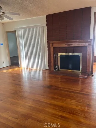 a view of a livingroom with wooden floor