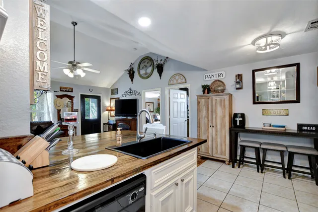 a room with furniture a clock and a mirror