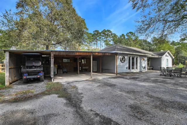 a view of a house with a yard and roof
