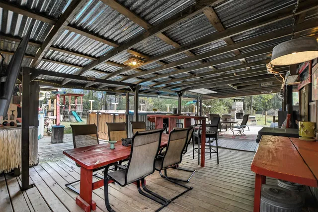 a dining room with furniture and wooden floor