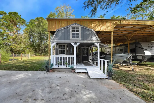 a room with lots of chairs and a large window