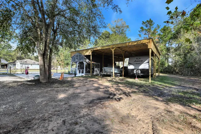 a view of a park with large trees