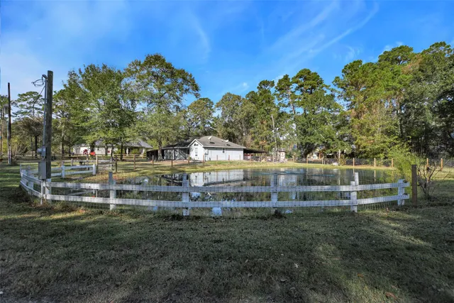 a view of pool with a big yard