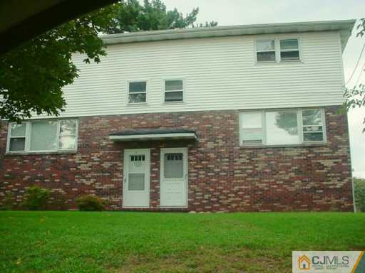 1 Fairview Avenue Edison, NJ 08817 - Photo 4 of 5 a brick house with a yard