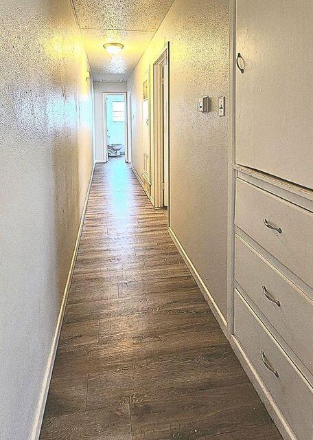 4401 31st Street Lubbock, TX 79410 - Photo 14 of 21 a view of a hallway with wooden floor