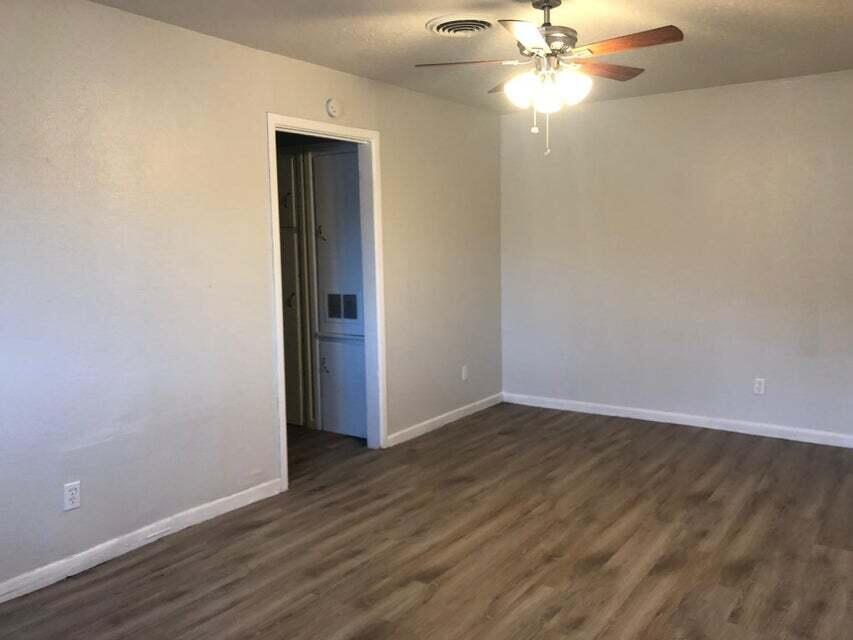 4401 31st Street Lubbock, TX 79410 - Photo 3 of 21 a view of an empty room with wooden floor