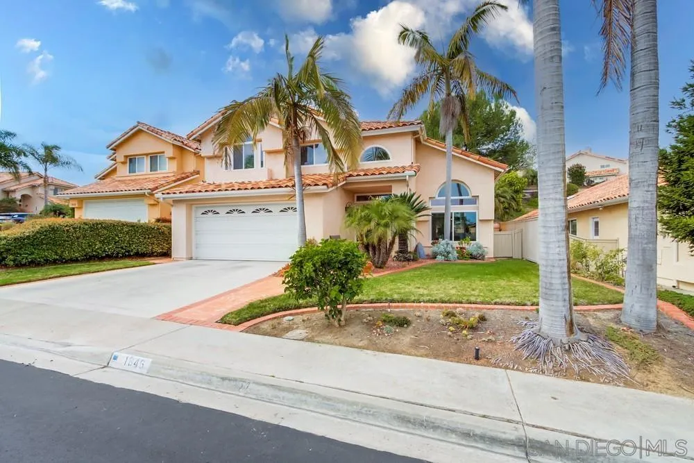 1846 Olympus Loop Drive Vista, CA 92081 - Photo 1 of 34 a front view of a house with a yard
