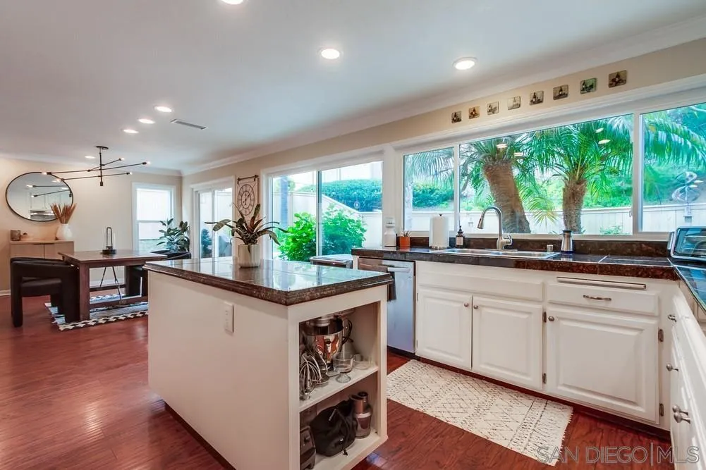 1846 Olympus Loop Drive Vista, CA 92081 - Photo 11 of 34 a kitchen with kitchen island and a large window