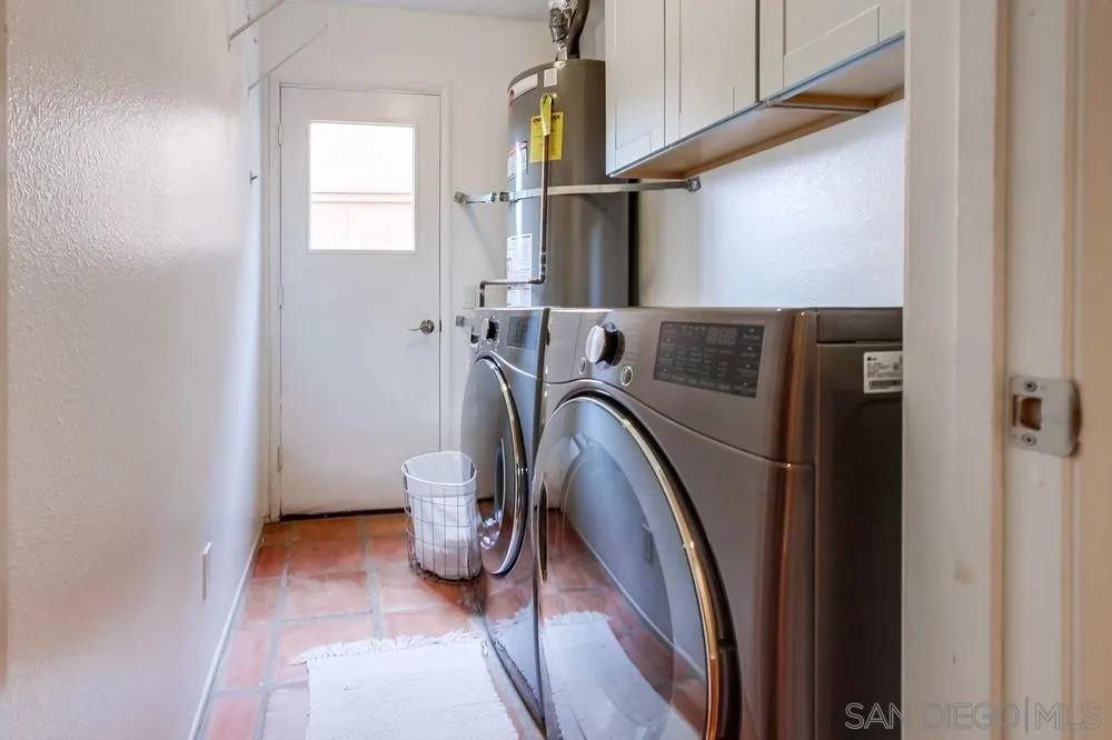 1846 Olympus Loop Drive Vista, CA 92081 - Photo 16 of 34 a view of walk in closet with clothes and shoes