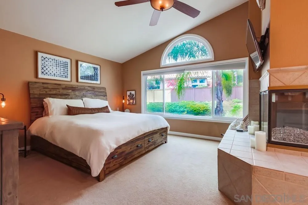 1846 Olympus Loop Drive Vista, CA 92081 - Photo 20 of 34 a bedroom with a bed and window