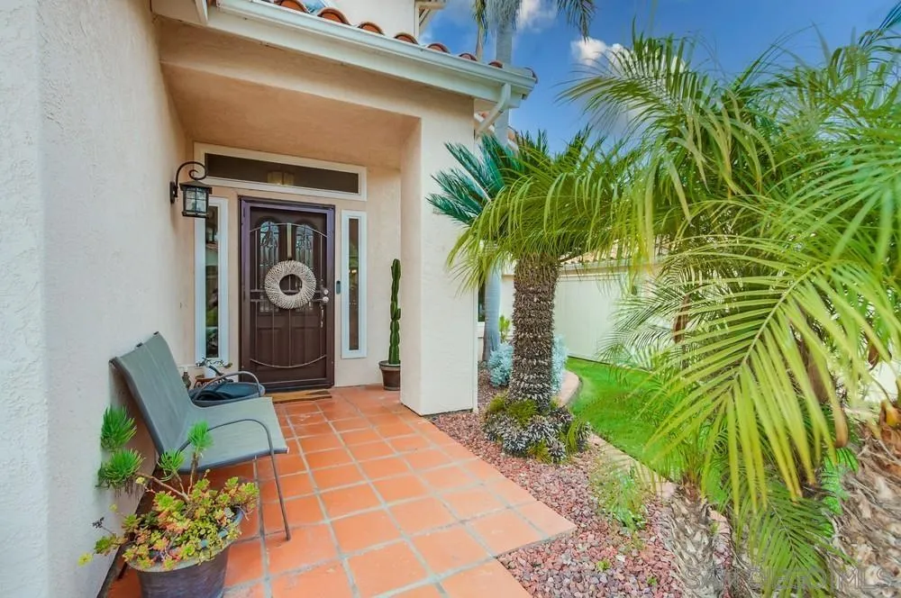 1846 Olympus Loop Drive Vista, CA 92081 - Photo 2 of 34 a couple of potted plants in front of door