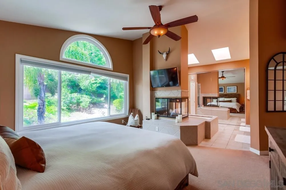 1846 Olympus Loop Drive Vista, CA 92081 - Photo 21 of 34 a bedroom with a bed and a large window