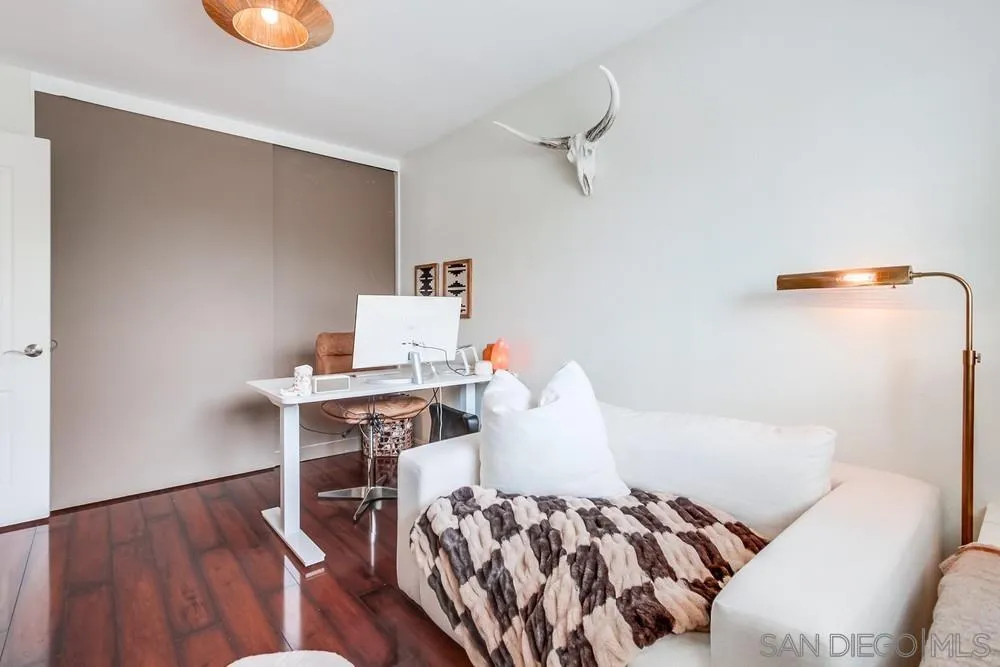 1846 Olympus Loop Drive Vista, CA 92081 - Photo 27 of 34 a bedroom with a bed and wooden floor