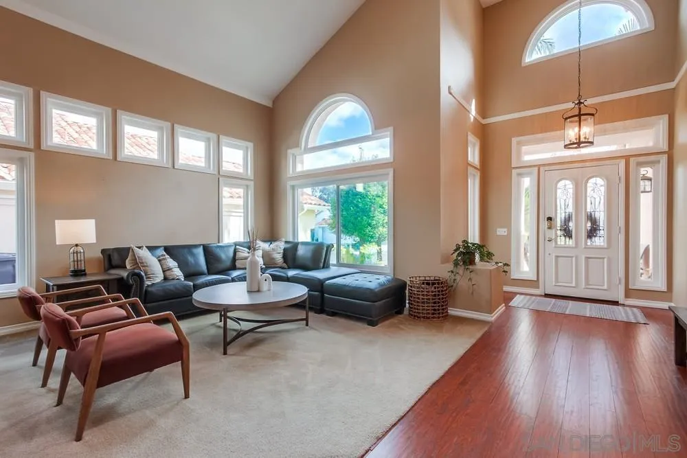 1846 Olympus Loop Drive Vista, CA 92081 - Photo 3 of 34 a living room with furniture and wooden floors