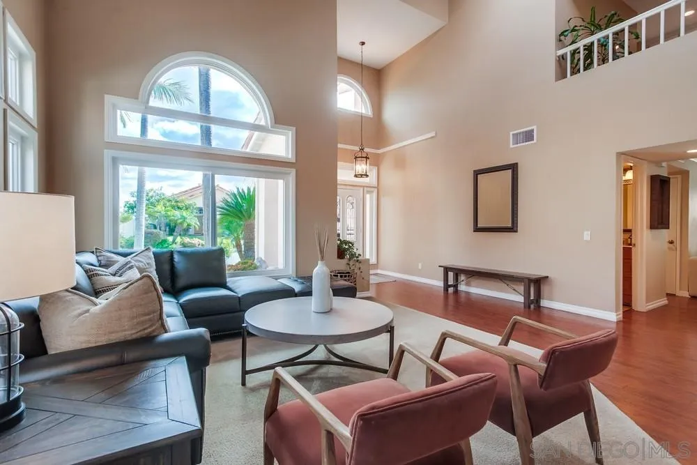 1846 Olympus Loop Drive Vista, CA 92081 - Photo 4 of 34 a living room with furniture a fireplace and a large window