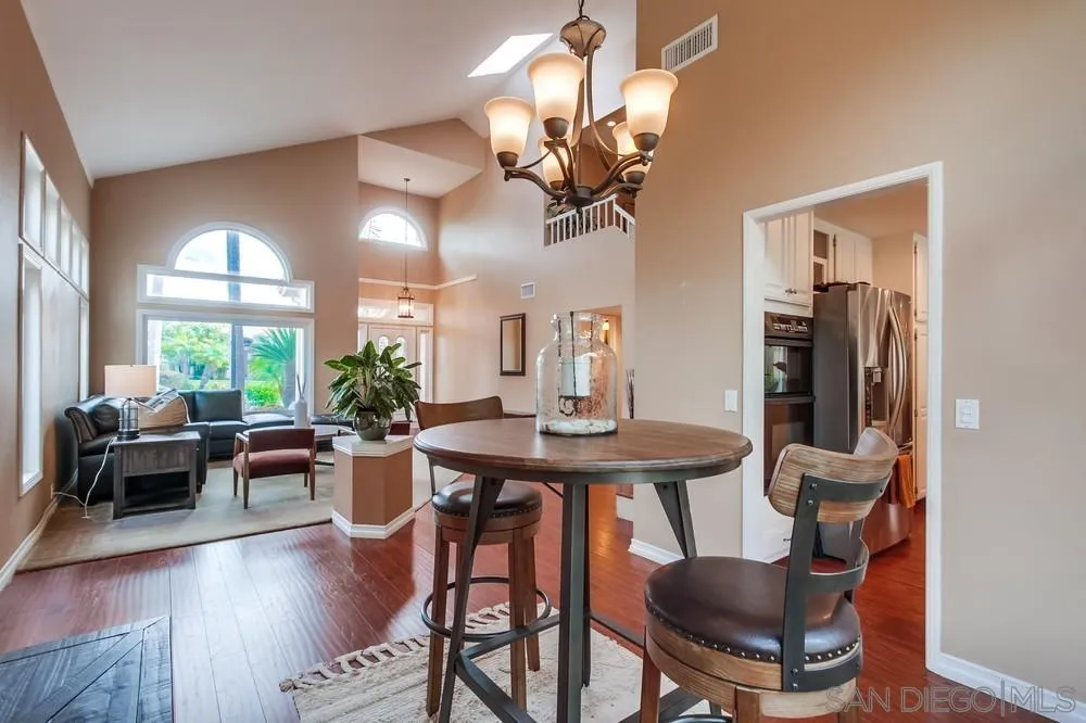 1846 Olympus Loop Drive Vista, CA 92081 - Photo 7 of 34 a view of a dining room with furniture window and wooden floor