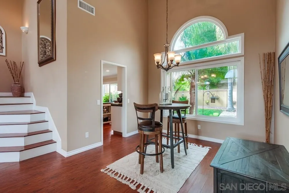 1846 Olympus Loop Drive Vista, CA 92081 - Photo 8 of 34 a view of a dining room with furniture window and wooden floor