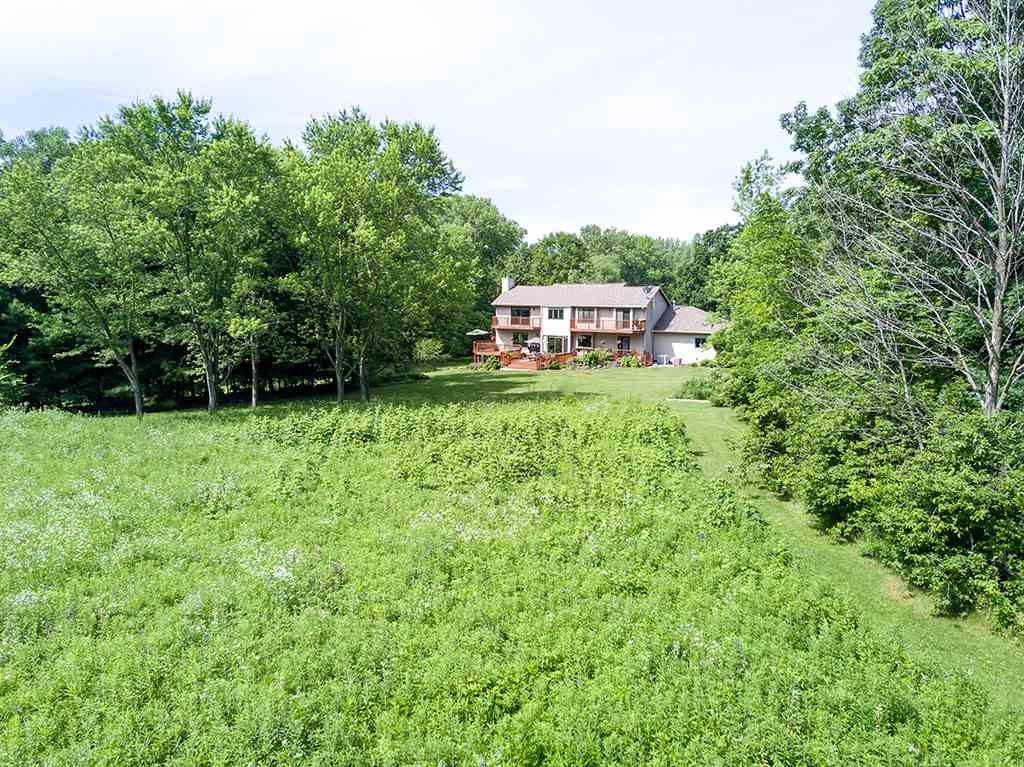 19139 Harnish Road Caledonia, IL 61011 - Photo 23 of 31 a house with green field in front of it