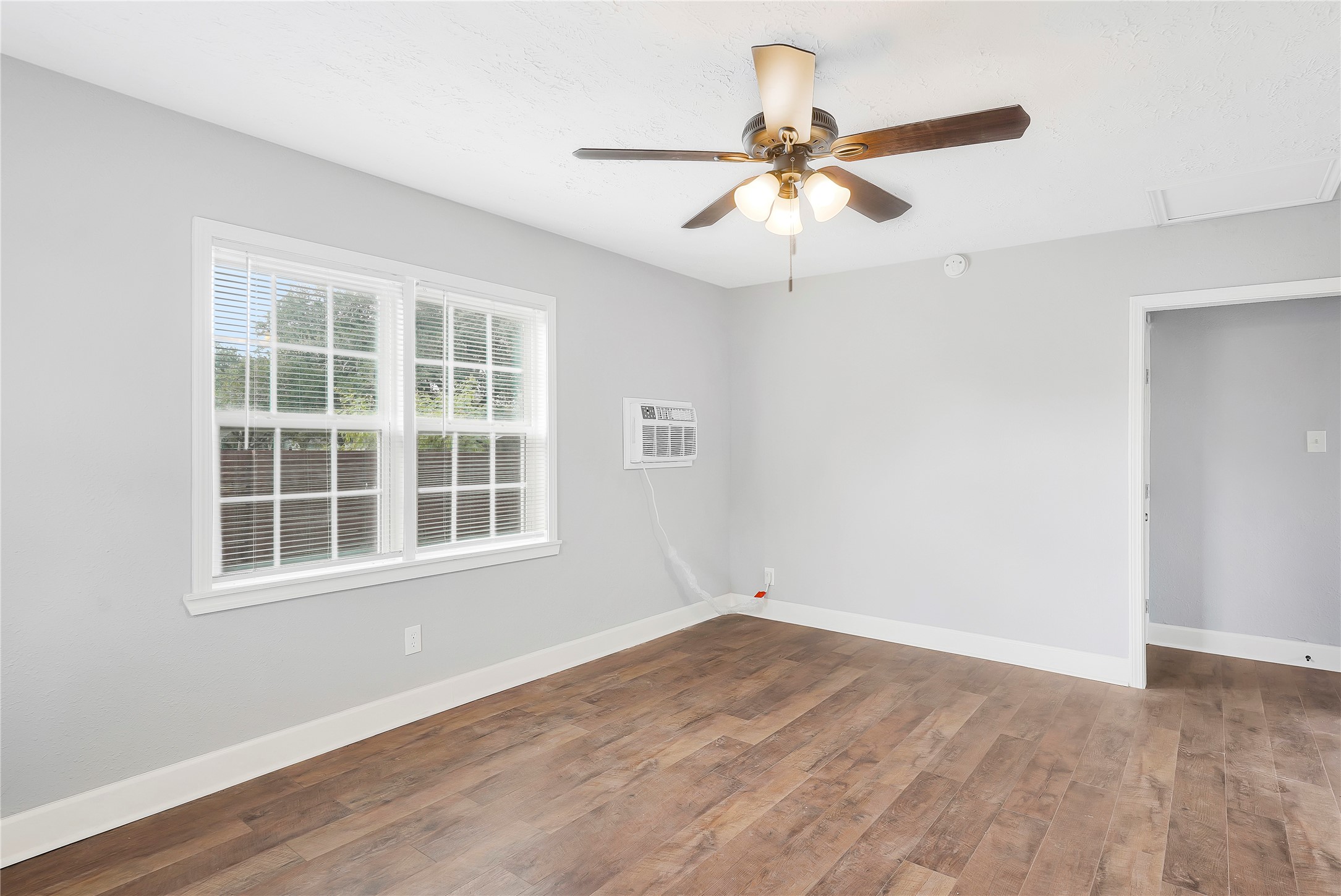 2311 North Louis Street Victoria, TX 77901 - Photo 15 of 21 a view of a room with wooden floor closet and windows