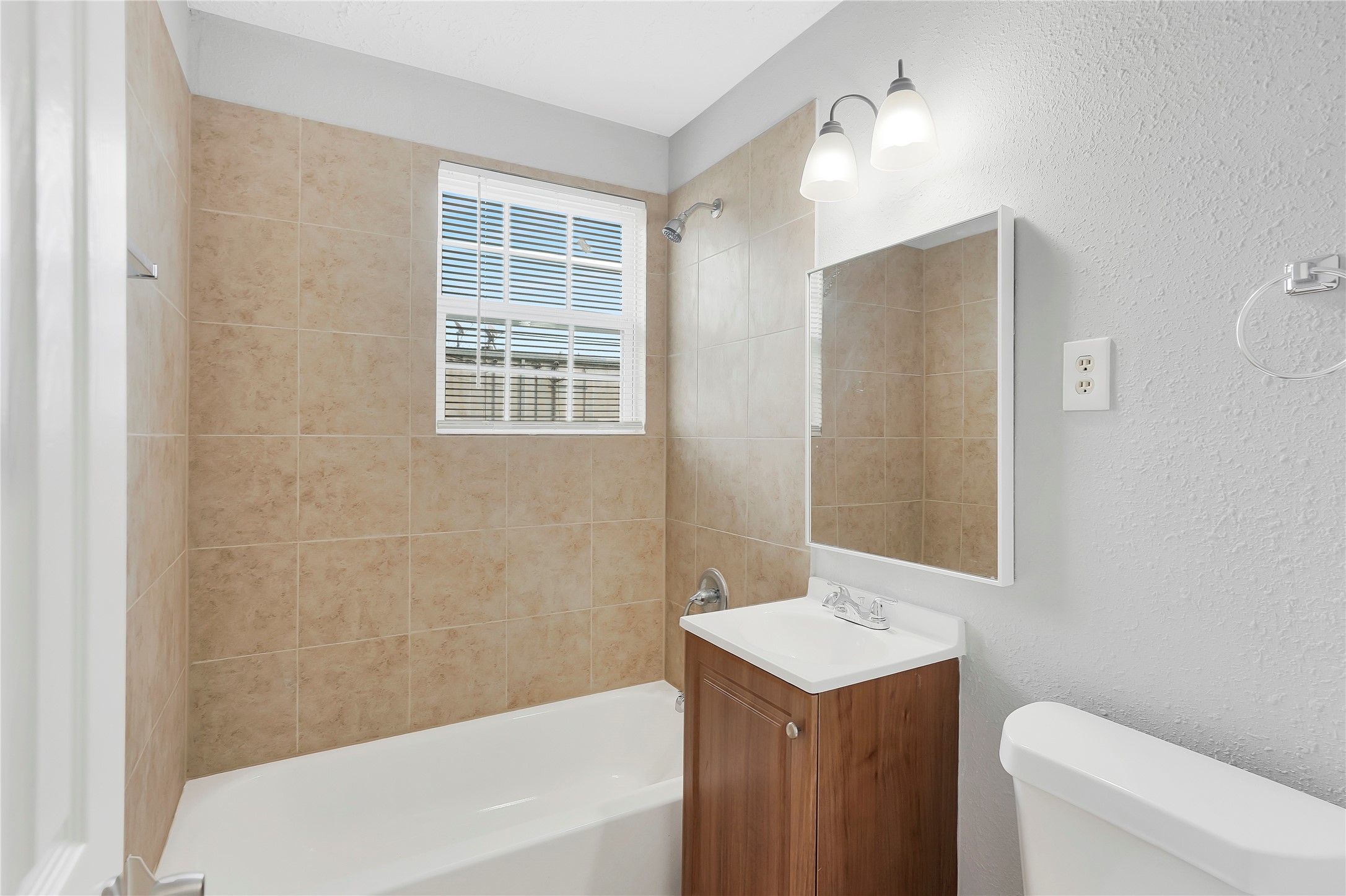 2311 North Louis Street Victoria, TX 77901 - Photo 5 of 21 a bathroom with a sink toilet and shower