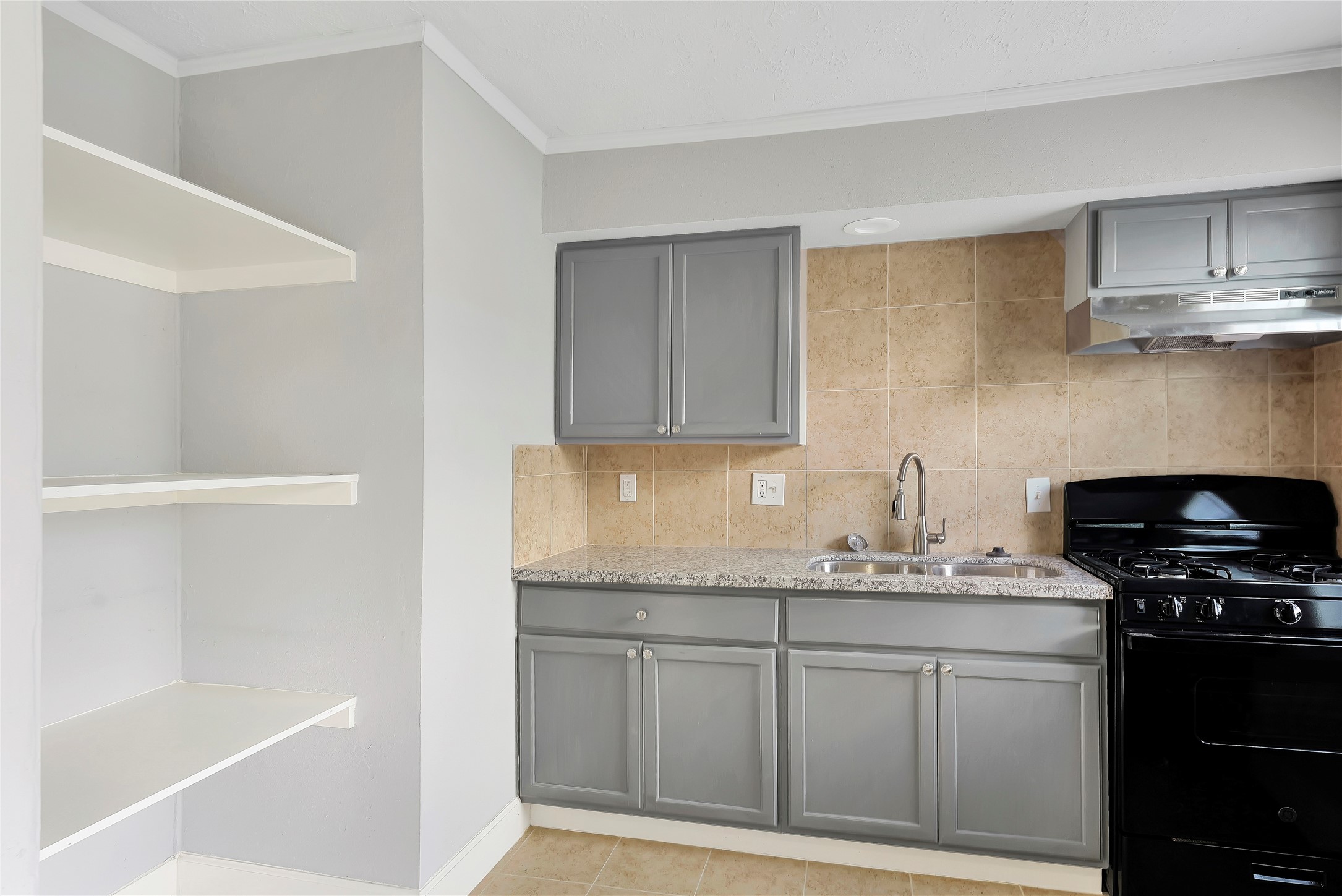 2311 North Louis Street Victoria, TX 77901 - Photo 6 of 21 a kitchen with stainless steel appliances granite countertop a sink stove and cabinets