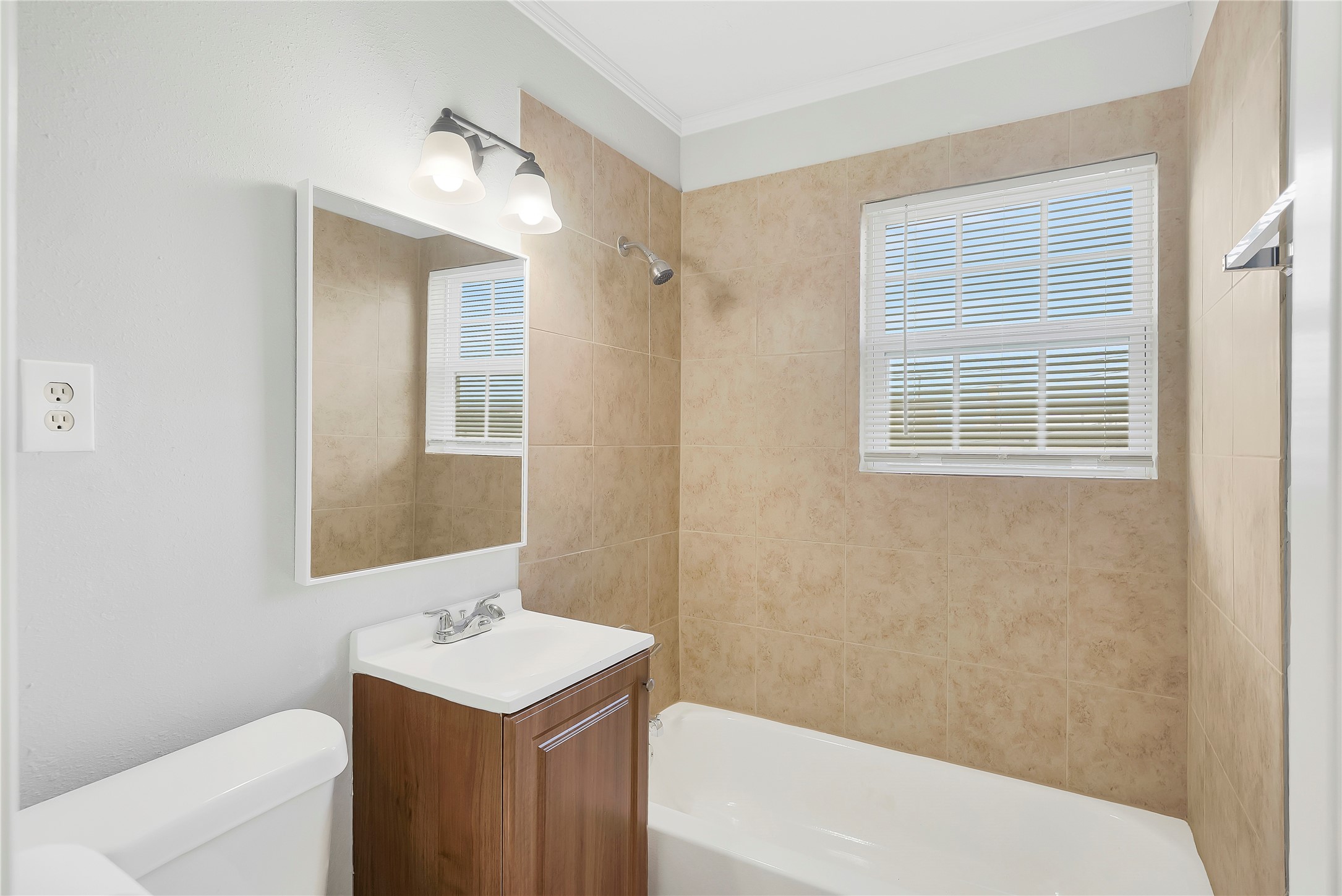 2311 North Louis Street Victoria, TX 77901 - Photo 10 of 21 a bathroom with a sink a toilet and shower