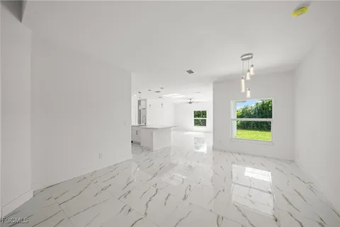 a view of a kitchen with a sink and a window