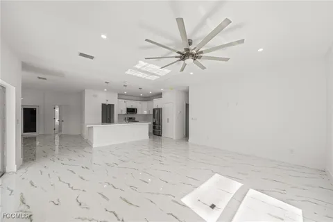 a view of a kitchen with a sink and a window