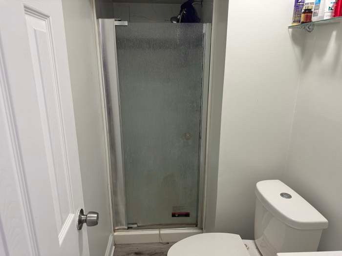 11540 South Racine Avenue Chicago, IL 60643 - Photo 17 of 19 a white toilet sitting next to a shower