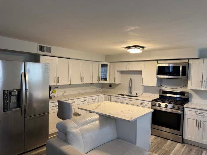 11540 South Racine Avenue Chicago, IL 60643 - Photo 5 of 19 a kitchen with stainless steel appliances granite countertop a refrigerator and a stove top oven