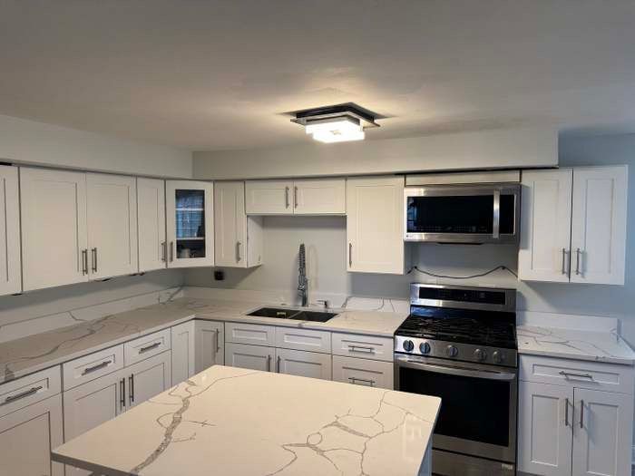 11540 South Racine Avenue Chicago, IL 60643 - Photo 7 of 19 a kitchen with a stove and a refrigerator