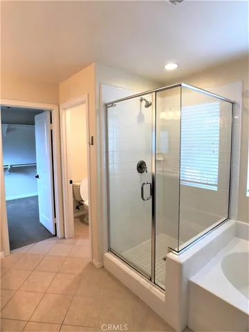 a bathroom with a shower and a sink